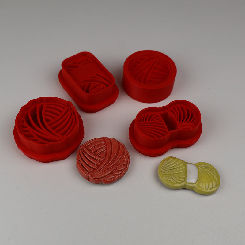 Garnnøgler udstikker med præg